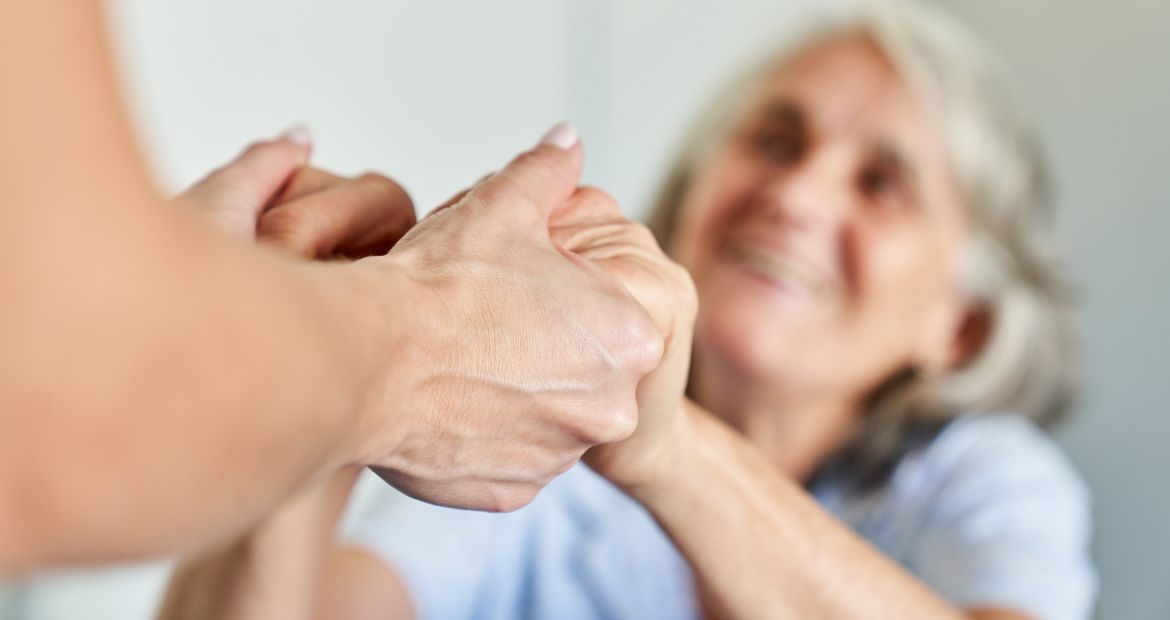 Hands of a Senior Citizen Hold for Support and Comfort