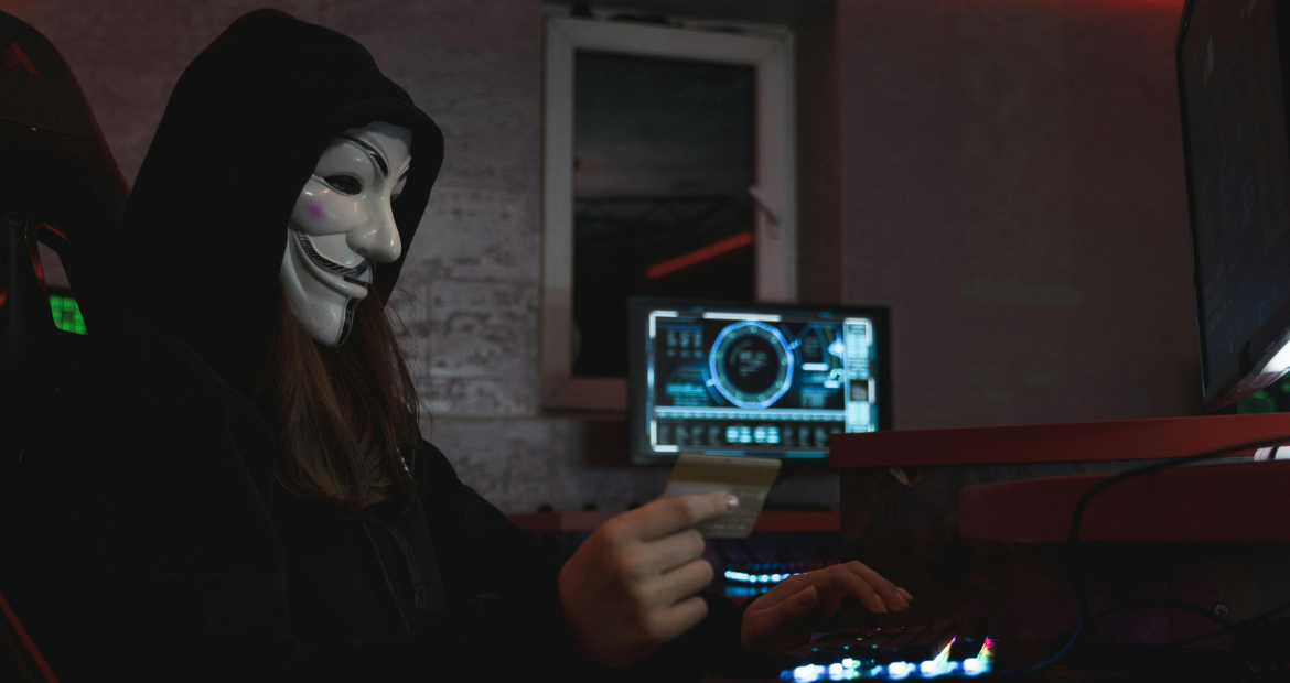 Woman in Black Hoodie Holding a Bank Card