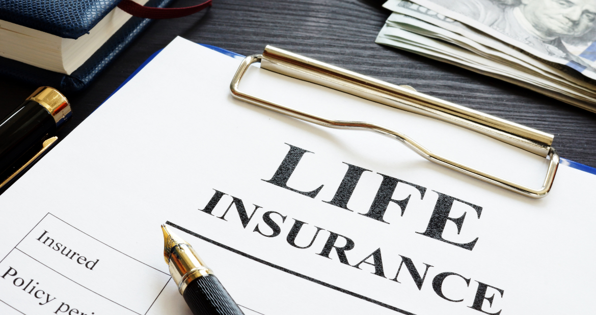 Whole life insurance pen and dollar banknotes.
