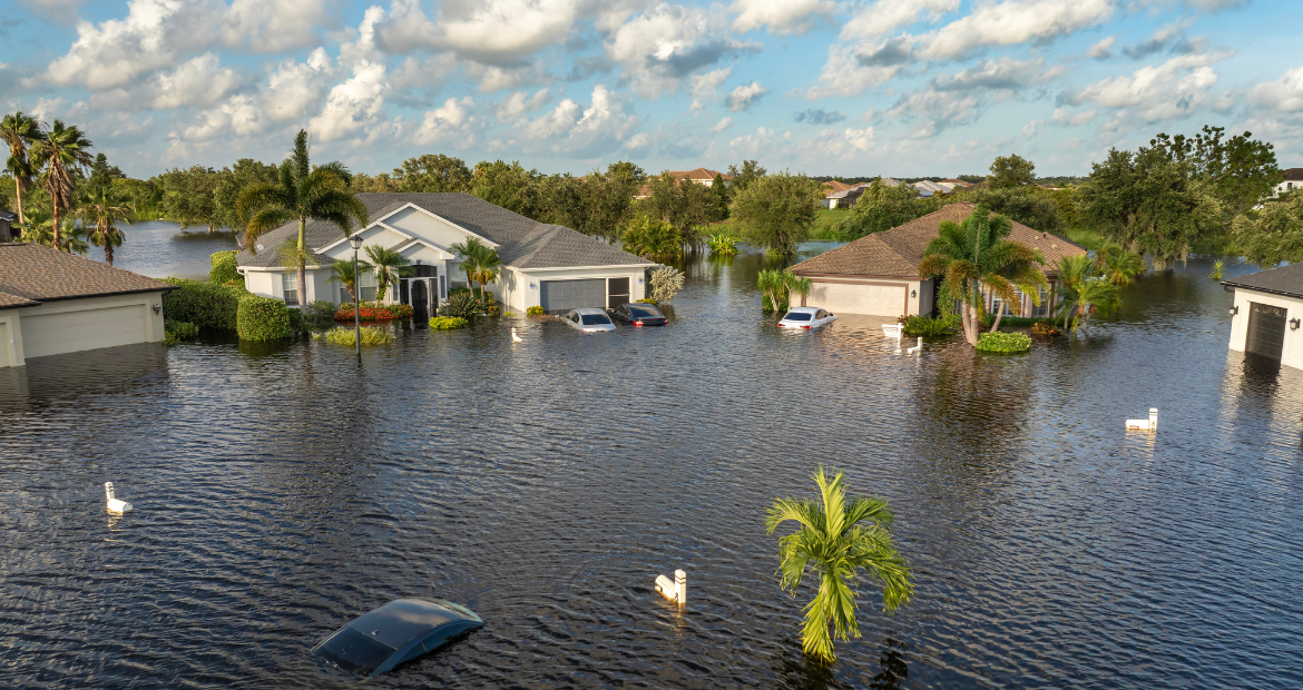 Flooded Florida street with stuck car